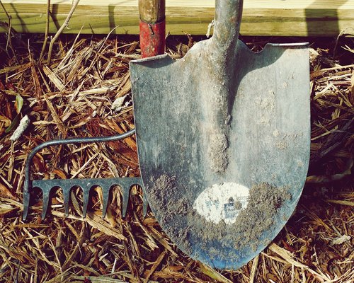 hands doing gardening work with soil